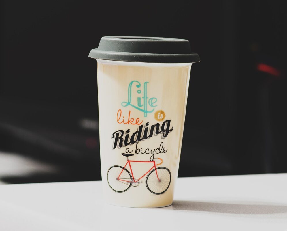 A stack of kraft paper coffee cups